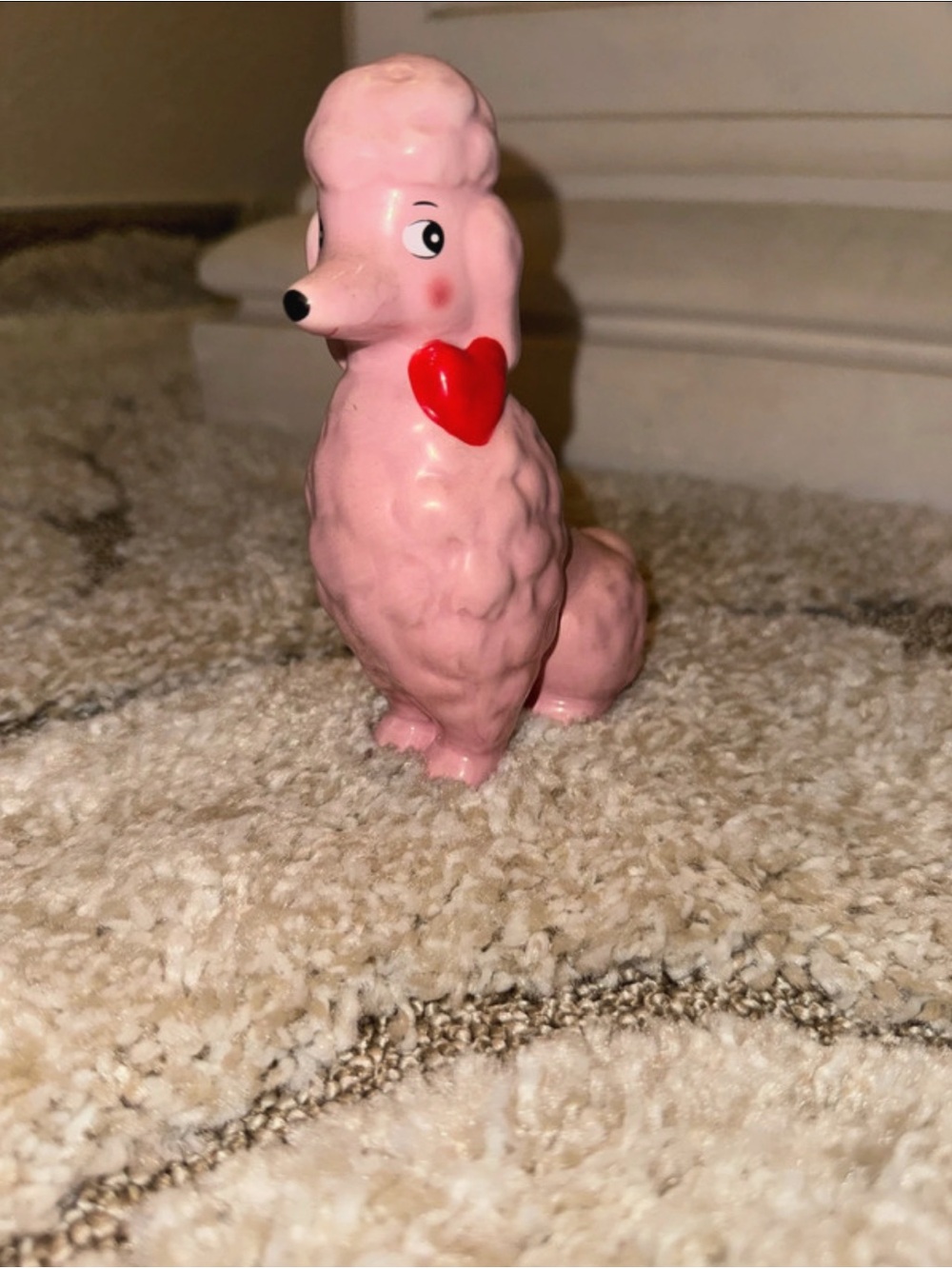 Pink poodle figurine with red heart